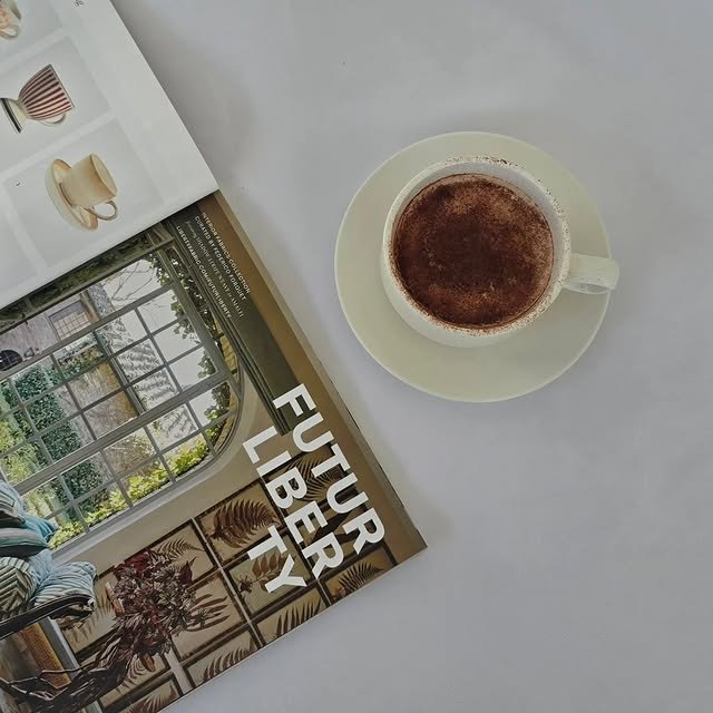 Hot chocolate served beside a design magazine