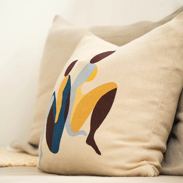 Hand-printed abstract cushion detail on a linen sofa