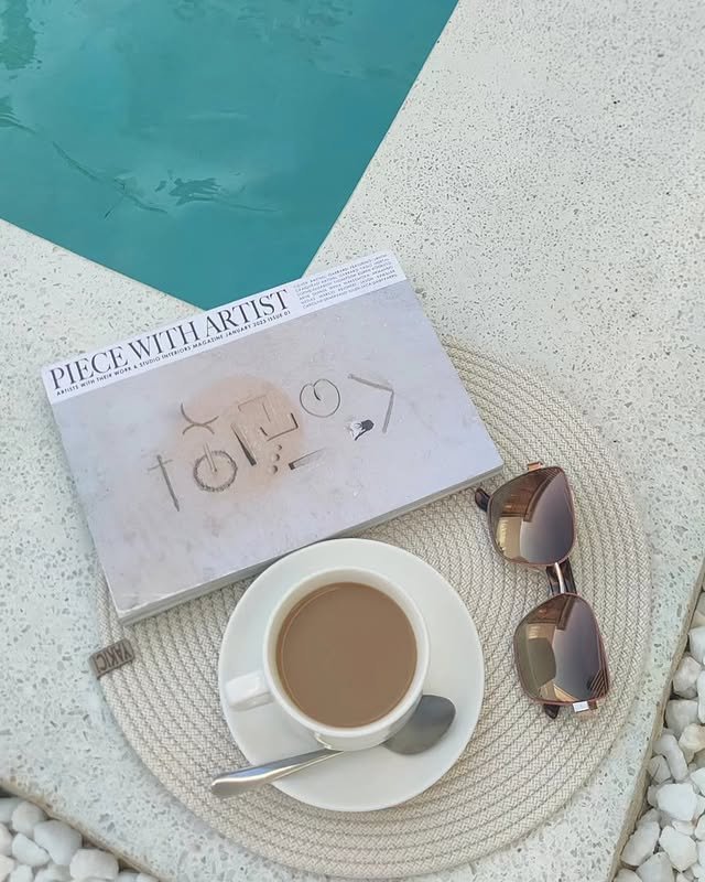 Coffee and a magazine beside the pool