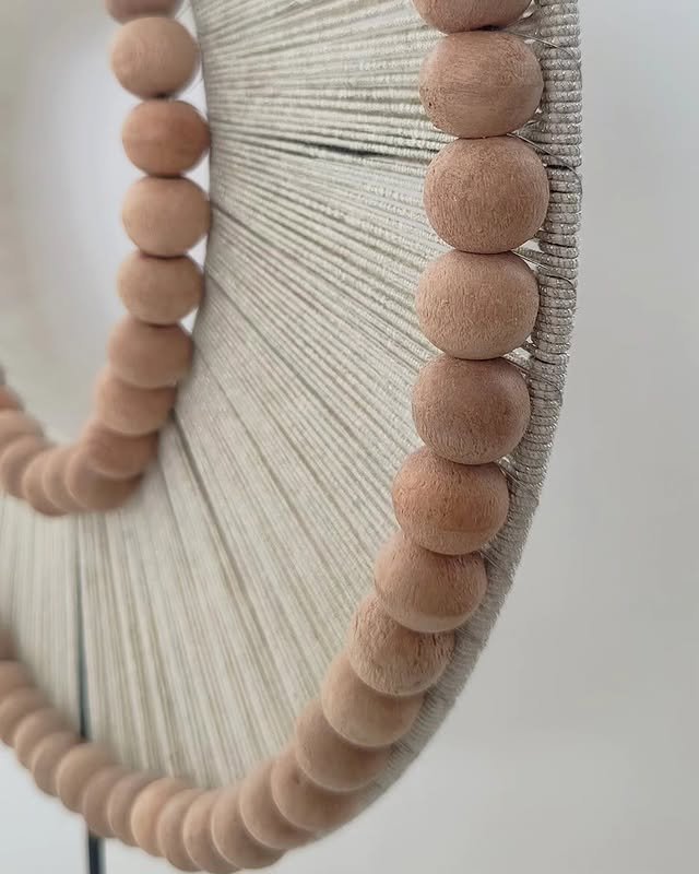 Woven wall hanging with wooden bead detailing